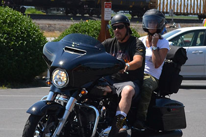 Two riders on a motorcycle.